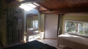 a bedroom with a bed and a window in a room at Relaxing Gite aux fil de l'eau in Sainte-Colombe-sur-lʼHers