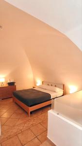 a bedroom with two beds in a room at Giù nei Sassi in Matera