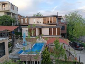 an aerial view of a house with a swimming pool at hill-fort kutaisi in Kutaisi