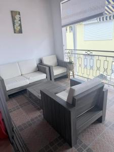 a living room with a couch and a table at Pépite Anses in Les Anses-dʼArlets