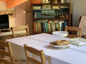 a white table with a bowl on top of it at B&B Da Mariella in Spigno Saturnia
