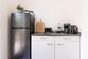 a kitchen with a stainless steel refrigerator at Apartment in Bayreuth in Bayreuth +2 photos