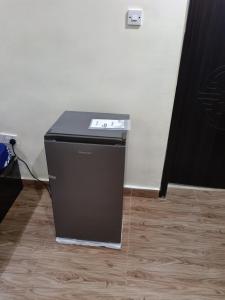 a black cpu sitting on the floor in a room at Bec property in Ikorodu
