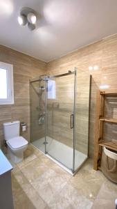 a bathroom with a shower and a toilet at La Casa de la Vall in Castellbell i Vilar
