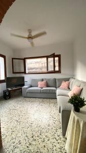 a living room with a couch and a table at La Casa de la Vall in Castellbell i Vilar