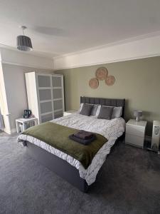 a bedroom with a large bed in a room at Lakenhow in Seascale