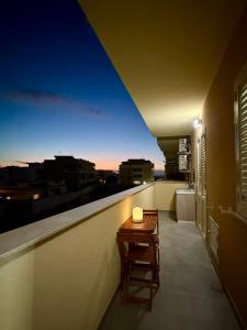 a small table on a balcony with a view at U Zu Ciccio in Terrasini