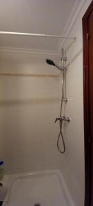 a shower in a bathroom with a bath tub at Rincón de Candelaria in Solórzano +14 photos