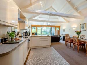 a kitchen and living room with a table and chairs at 2 Bed in Wells oc-46310 in Wells