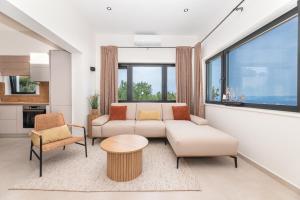 a living room with a couch and a table at Villa Andrea in Splitska