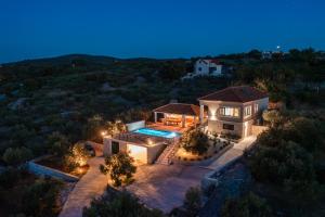 an aerial view of a house with a swimming pool at Villa Andrea in Splitska
