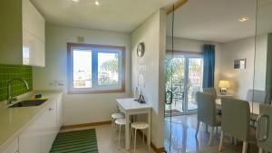 a kitchen with a sink and a counter top at Garden Hill M - Shared Pool - 6 Guests - Albufeira in Albufeira