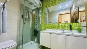 a bathroom with a sink and a shower and a toilet at Garden Hill M - Shared Pool - 6 Guests - Albufeira in Albufeira
