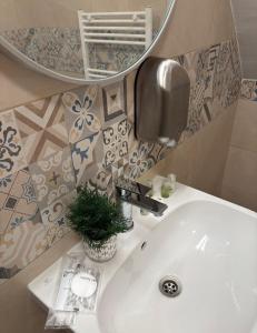 a bathroom with a white sink and a mirror at Croatia Palace - Ravna Gora in Ravna Gora +37 photos