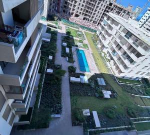 an aerial view of a courtyard in a building at Charmant studio, piscine proche mer in Aïn Harrouda