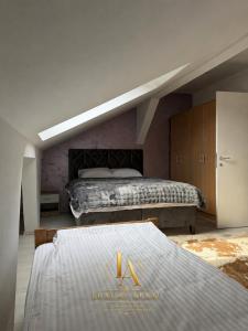 a bedroom with a bed with a luxury agent sign on it at Luxury Apartments in Brčko