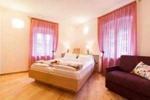 Postel nebo postele na pokoji v ubytování Bio Agritur Le Millemele