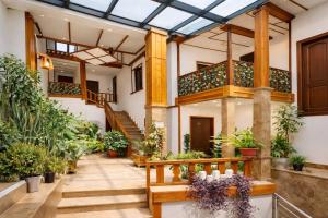 an indoor garden with potted plants in a building at Old Yerevan by IGIT in Yerevan
