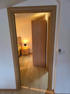 a door leading to a bedroom with a room at Lily 1 in Ljubuški