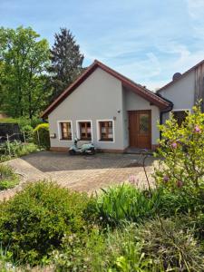 a house with a scooter parked in front of it at LIV Retreat in Dietenhofen