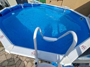 an empty swimming pool in the middle of a pool at Frix Balaton in Balatonalmádi