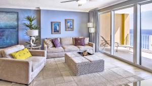 a living room with a couch and a table at Luxury Vacation Escape Free Beach Service Come Relax Book Now! in Panama City Beach