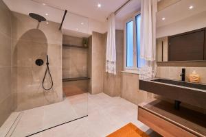 a bathroom with a shower and a sink at Doretta's House - Luxury Apartment in Noli +82 photos