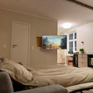 a bedroom with a bed and a painting on the wall at Oslo, Classic Apartment in Oslo