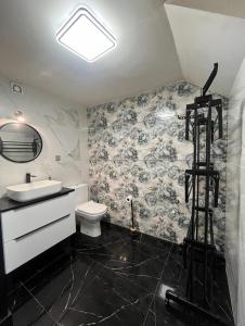 a bathroom with a sink and a toilet in it at Szlachcianka in Gorzuchów +7 photos