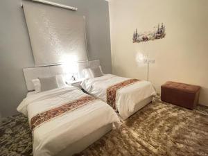 a hotel room with two beds in a room at بيت لانا in Abha