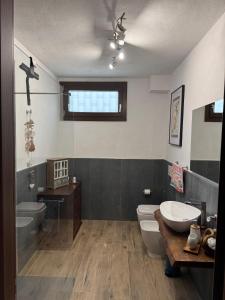a bathroom with a toilet and a tub and a sink at B&B Borgo dei Cedri in Pontecchio +43 photos