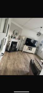 a living room with a couch and a basketball hoop at Glenmore in Doonbeg