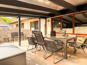 a patio with a table and chairs on a patio at TheSlowMorningNo1 in Cuxhaven