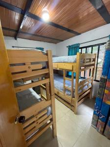 a room with two bunk beds and a door at Casa campestre Shalom in Vergara +47 photos