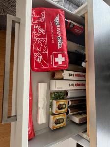 a drawer filled with food and books in a kitchen at Kystvejen 40F in Hadsund