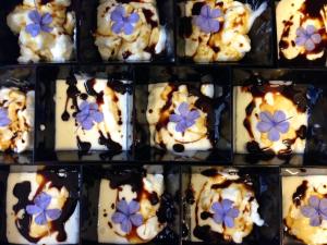 a display of cookies with blue flowers on them at Hotel Solitude in Riccione