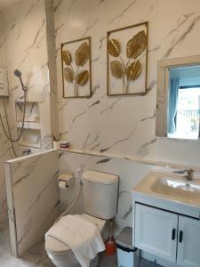 a bathroom with a toilet and a sink at บ้านแสนสุข Hun Hin in Hua Hin +37 photos