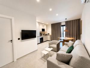 a living room with a couch and a table at OMO STAYS Pinada Park in Guardamar del Segura