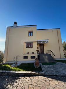 a house with a staircase in front of it at House Tramonto D'oro in Ficulle