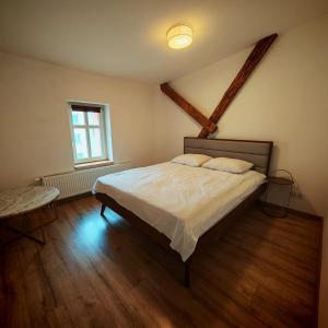 a bedroom with a bed and a window at Bramkowa 5 in Skorka
