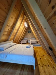 a room in the attic with two beds at LakeSideCottage in Plav