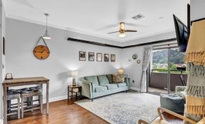 a living room with a couch and a table at Uptown Gatlinburg in Gatlinburg