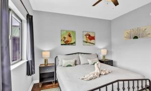 a bedroom with a bed with two tables and two lamps at Uptown Gatlinburg in Gatlinburg +19 photos