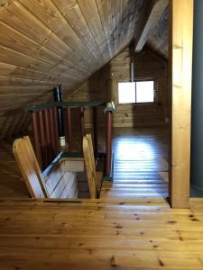 an inside view of a wooden cabin with wooden floors at Timber cabin, centrally located in Bodø in Bodø