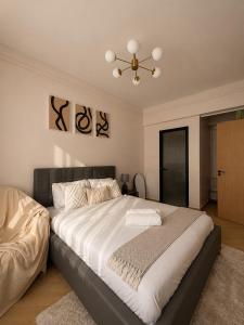 a bedroom with a large bed with a ceiling at Oderm one bedroom apartment in Syokimau near jkia airport and sgr station in Nairobi in Nairobi +11 photos
