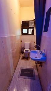 a small bathroom with a sink and a toilet at Temple host in Cairo +63 photos