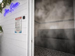 a garage door with a purple sign on it at Bolero Resort in Wildwood +49 photos