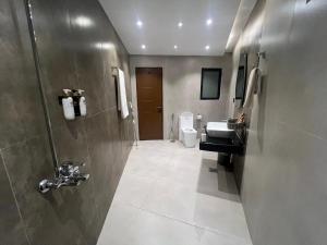a bathroom with a sink and a toilet at HSQ Towers in Murree +60 photos
