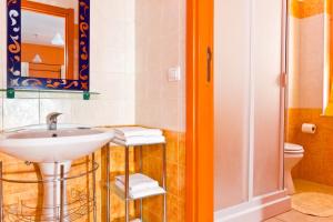 a bathroom with a sink and a toilet at Marisal Accommodation in Alghero