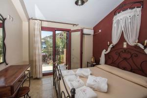 Кровать или кровати в номере GreKa Ionian Suites